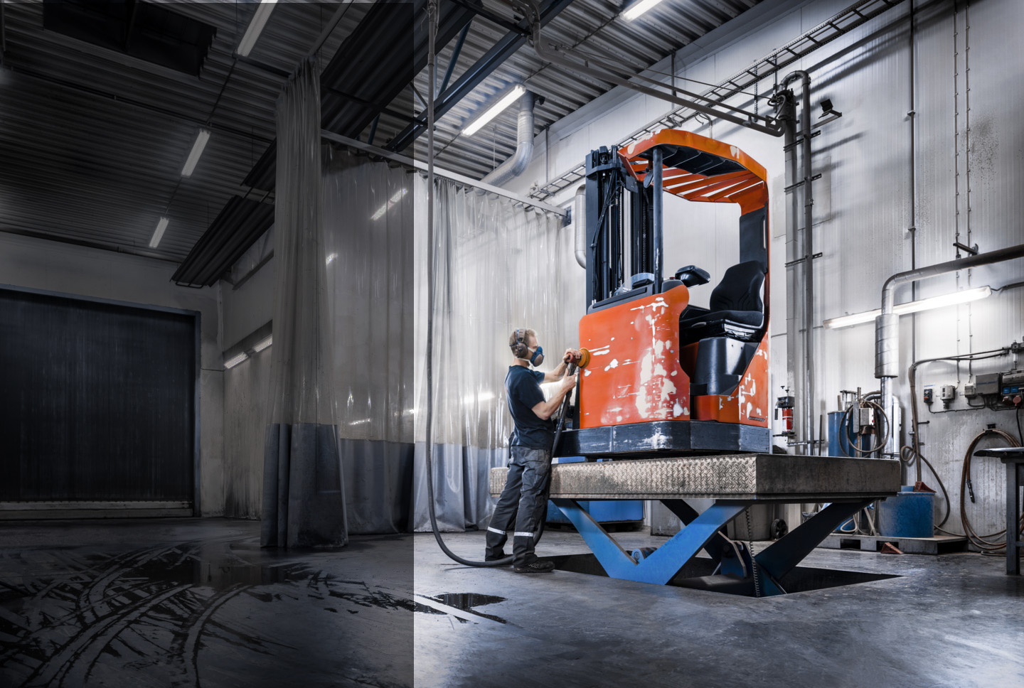 Worker refurbushing Toyota used forklift